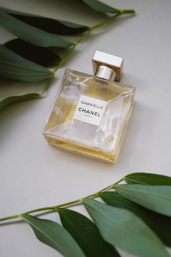 gabrielle perfume resting on a surface